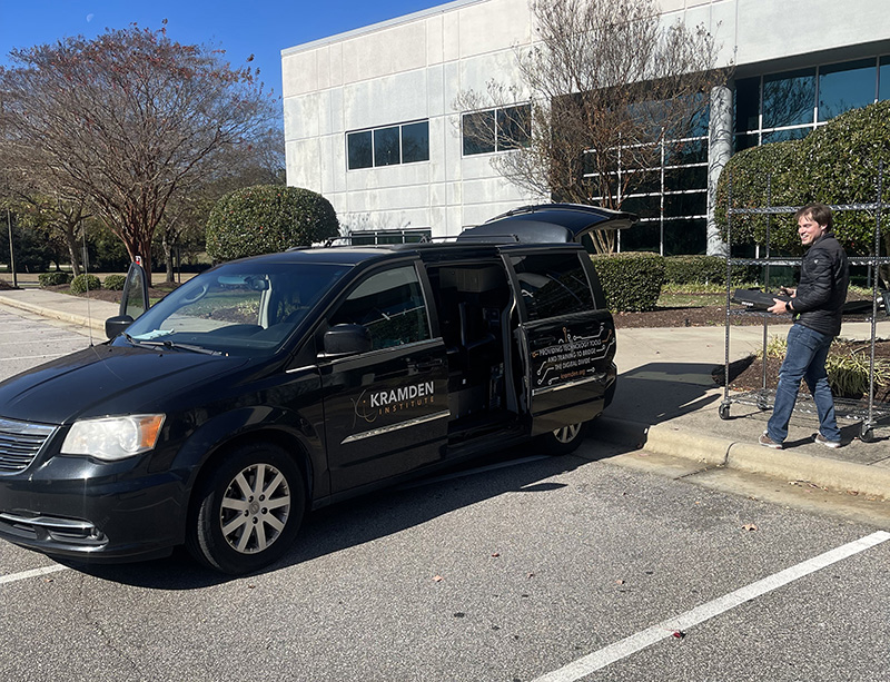 A van belonging to the Kramden Institute being loaded with donations